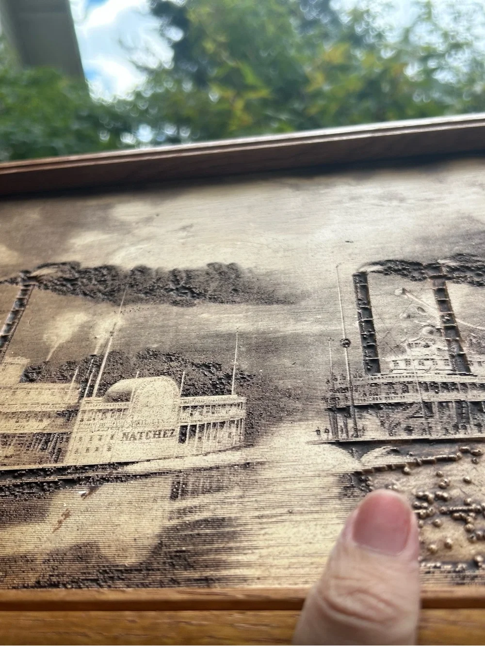 vintage wood-burned or engraved art titled 